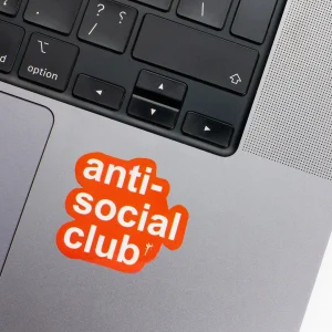 Vinyl Laptop Sticker irregular english text hell yes shape with orange 3mm outline round corner and white text on macbook beside keyboard