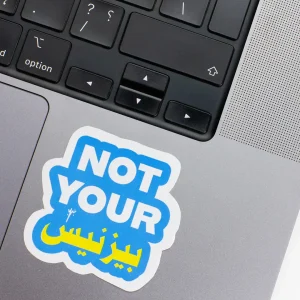 Vinyl Laptop Sticker irregular english text Not your business shape with white 3mm outline round corner and white text blue background on macbook beside keyboard