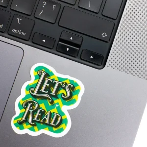 Vinyl Laptop Sticker irregular english text Lets read shape with white 3mm outline round corner and green text on macbook beside keyboard