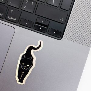 Holographic Laptop Sticker irregular shape of black cat with round corner on macbook beside keyboard with inner fill shiny metallic rainbow effect