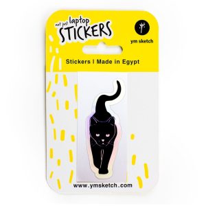 Holographic Laptop Sticker irregular kiss cut shape black cat with shiny rainbow effect border inner fill shiny metallic rainbow effect in YM Sketch packaging yellow and white color with phrase not just laptop stickers made in egypt