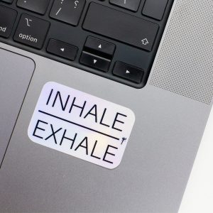 Holographic Laptop Sticker rectangle shape with round corner with black text Inhale Exhale on a macbook corner laptop with inner fill shiny metallic rainbow effect